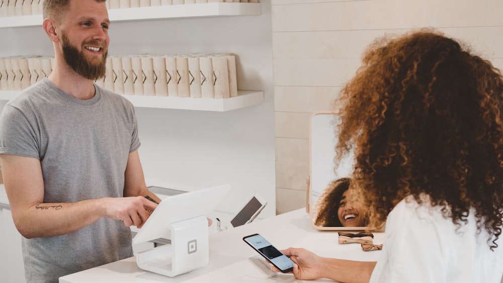 Customer making a contactless payment at a retail store counter